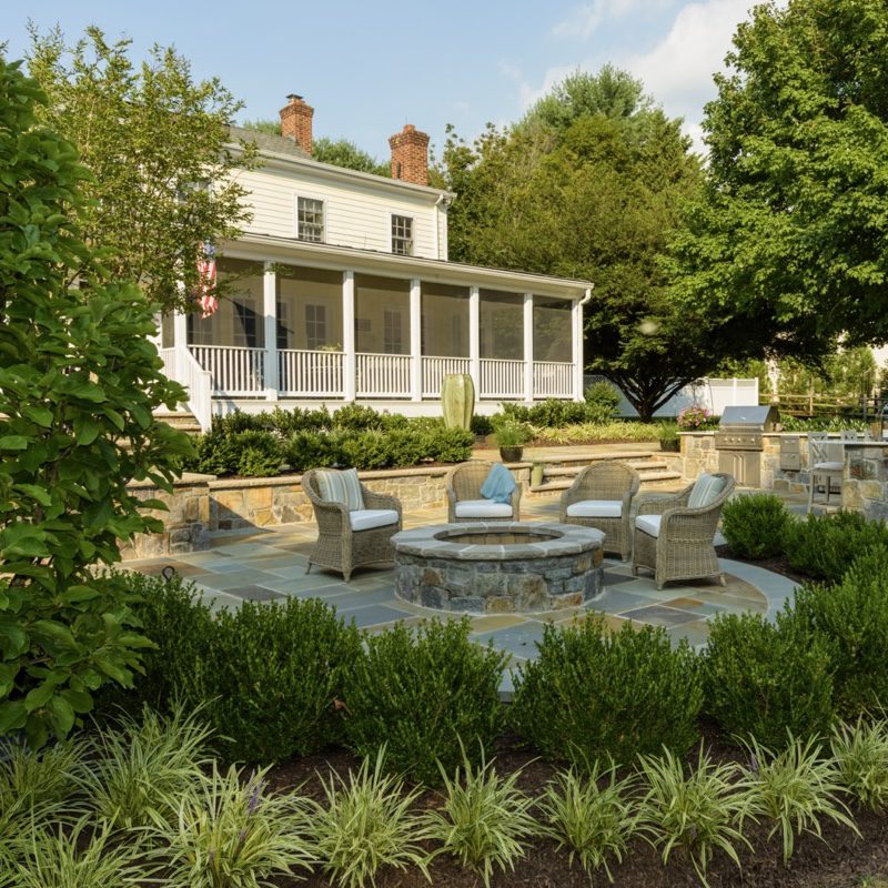 stone fire pit on flagstone patio