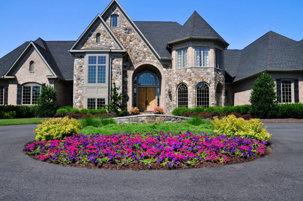 Landscape Planting with Seasonal Flowers Stone Accent Wall