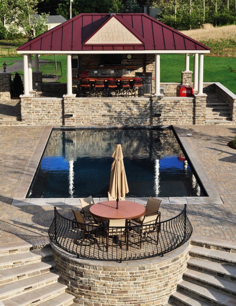Custom Pool with Covered Pavilion Paver Pool Deck Stone Walls with Steps