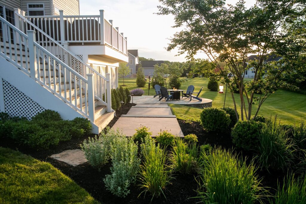 Elevated Flagstone Patio with Landscape Plantings Custom Composite Deck