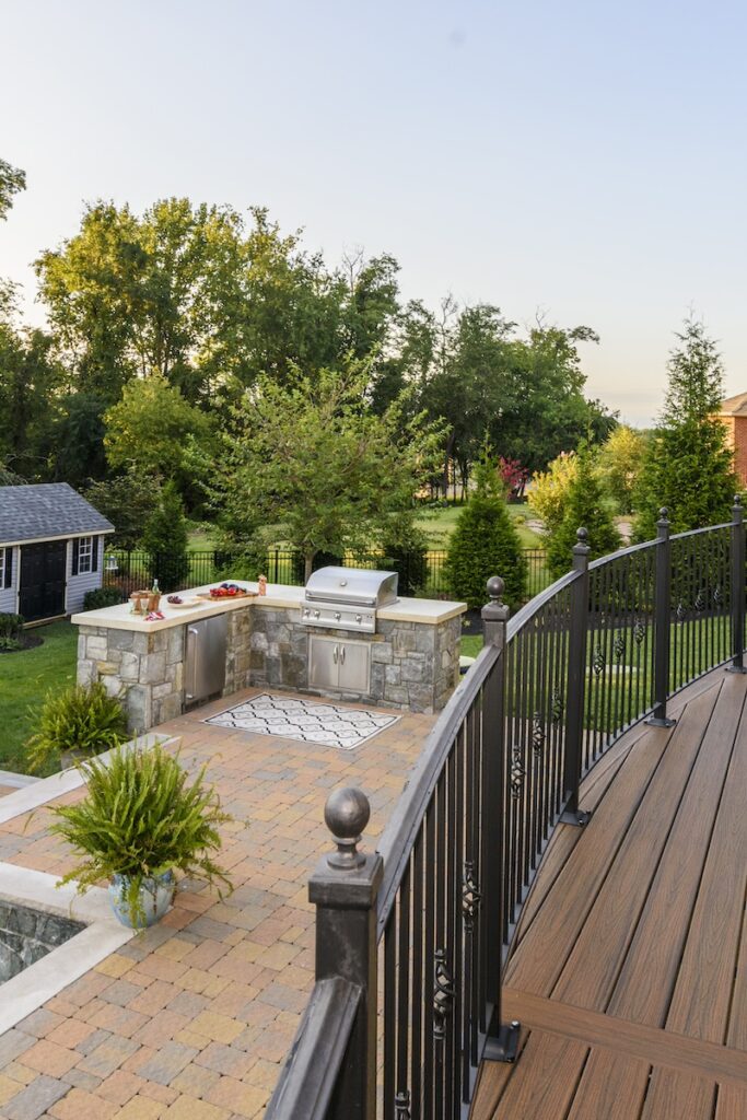 stone outdoor kitchen with concrete countertop