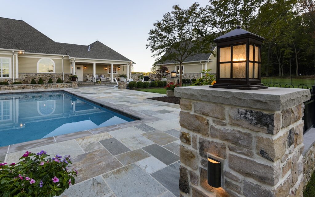 swimming pool with flagstone pool deck
