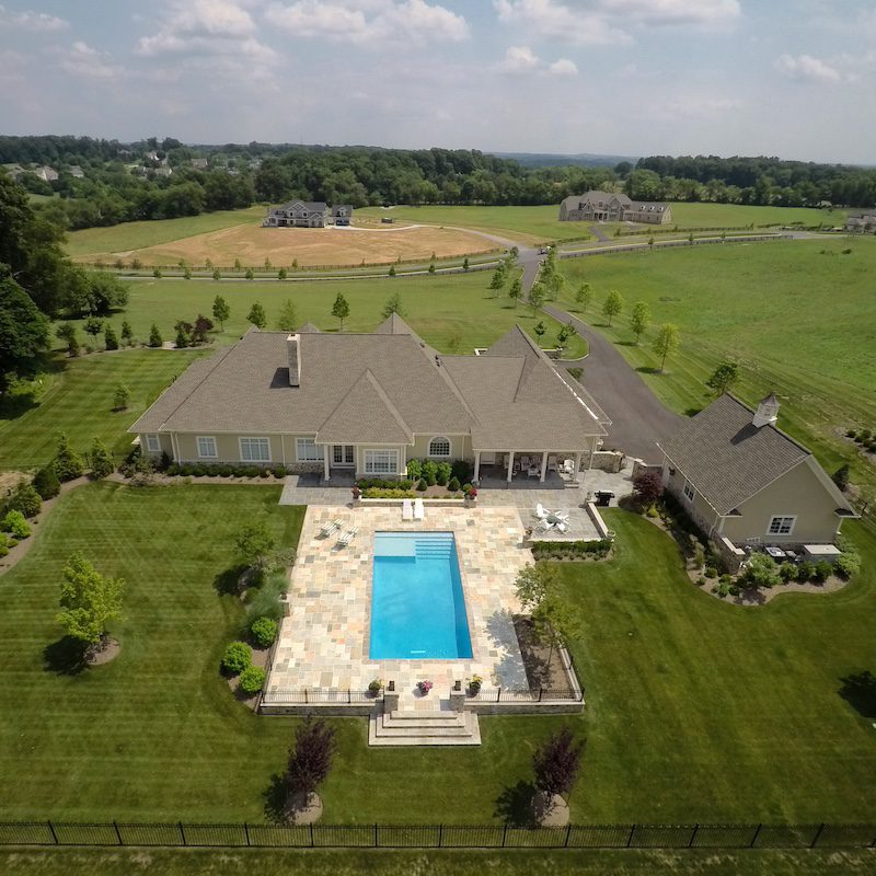 aerial view of pool and backyard