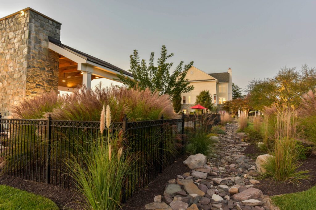 Clearwater Landscape & Nursery Hardscape Outdoor Fireplace Custom Pavilion Landscape Plantings Dry Creek Bed