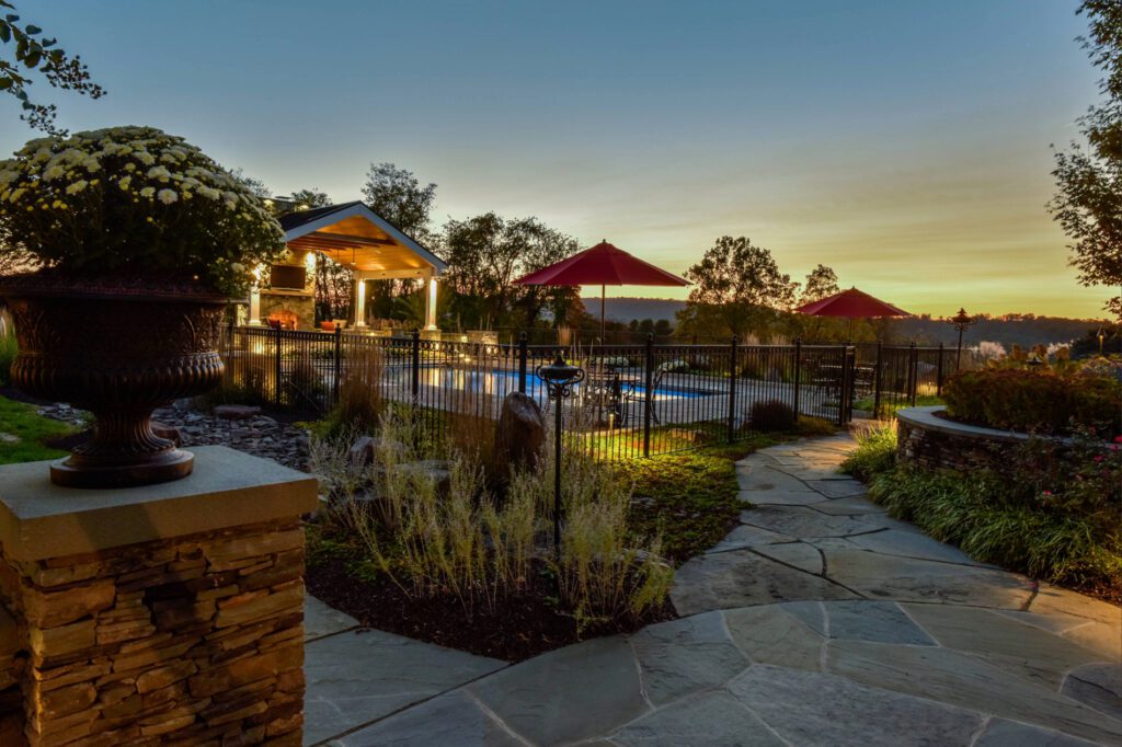 Clearwater Landscape & Nursery Hardscape Flagstone Patio Paver Patio Stone Walls Stone Piers Outdoor Fireplace Custom Pavilion Landscape Plantings Swimming Pool Dry Creek Bed Landscape Lighting