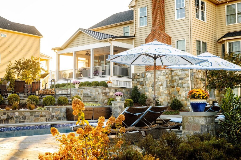 Clearwater Landscape & Nursery Hardscape Swimming Pool Flagstone Patio Stone Retaining Wall Stone Piers Landscape Plantings Screened Porch