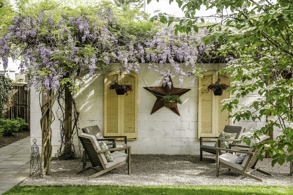 Decorative Gravel Patio Seating with Custom Pergola with Wisteria