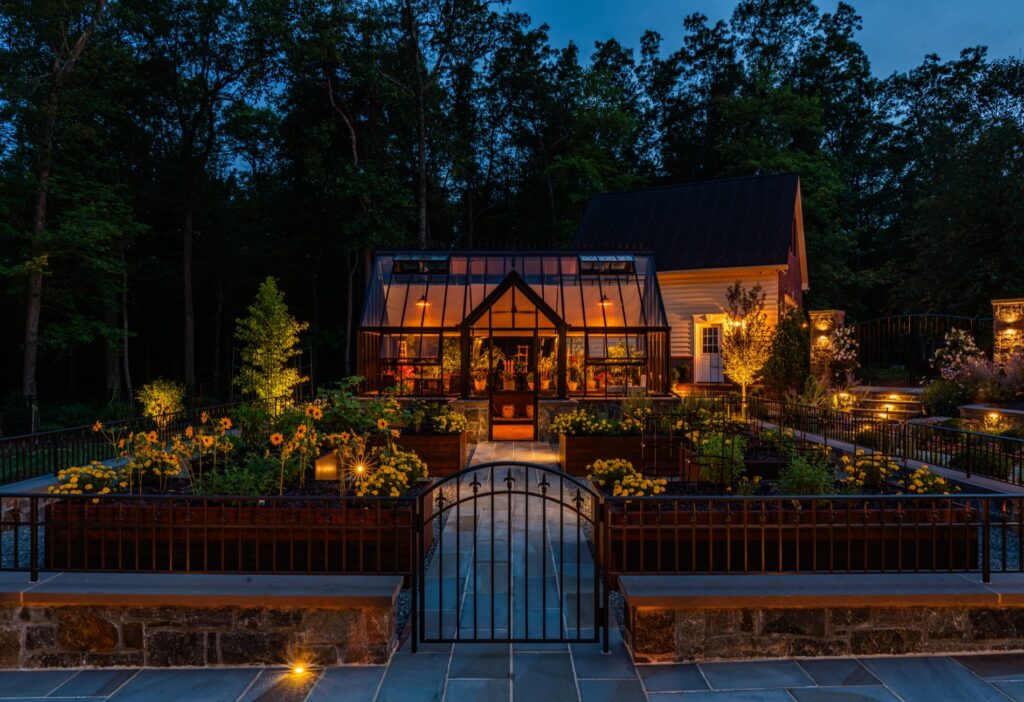 Backyard garden project with Hartley Botanic Glass Greenhouse and raised Corten steel garden planters. Landscape Plantings Low Voltage Lighting Flagstone Walkway