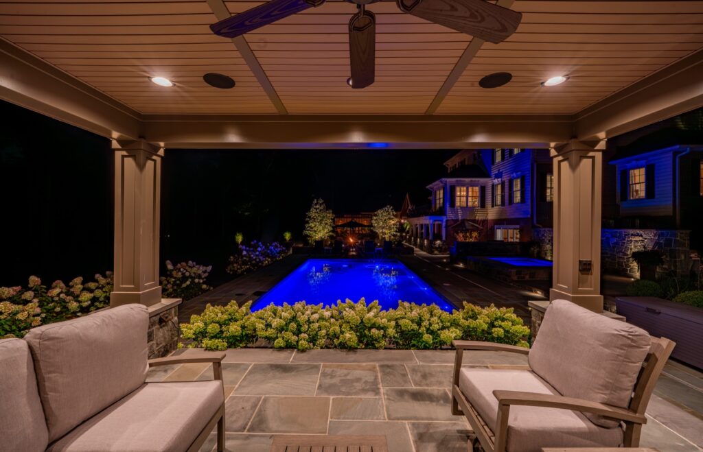 Custom Elevated Pool Pavilion and Swimming Pool in Backyard Landscape Planting with Lighting