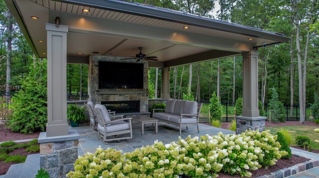Covered Pavilion with Fireplace and TV Landscape Plantings