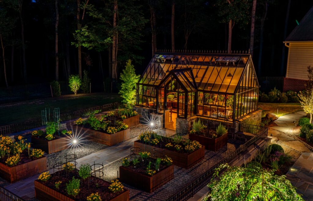 Backyard garden project with Hartley Botanic Glass Greenhouse and raised Corten steel garden planters. Landscape Plantings Low Voltage Lighting Flagstone Walkway