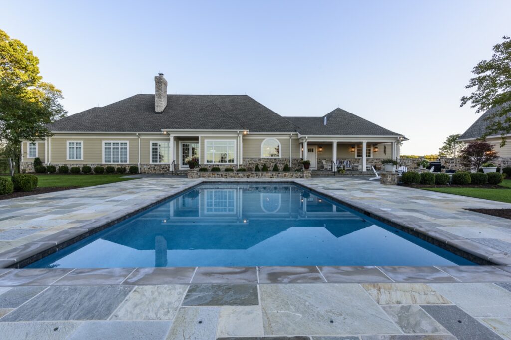 swimming pool with flagstone pool deck