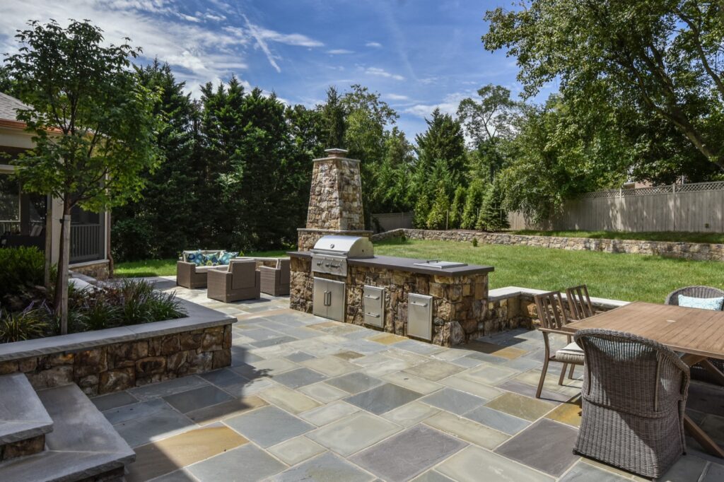 bbq kitchen patio with stone fireplace