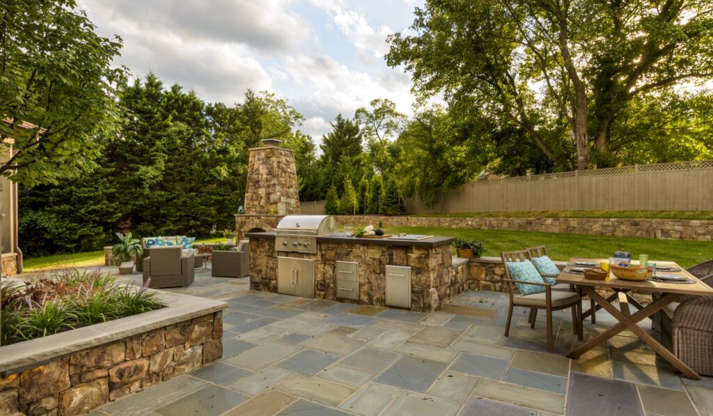 bbq kitchen patio with stone fireplace