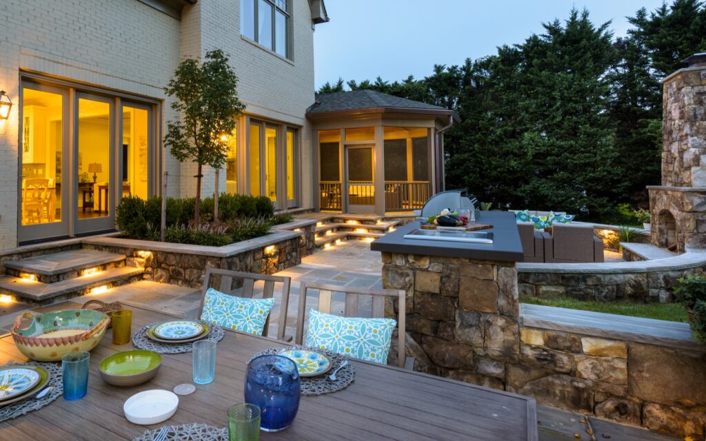 screened porch and bbq kitchen patio with stone steps outdoor stone fireplace