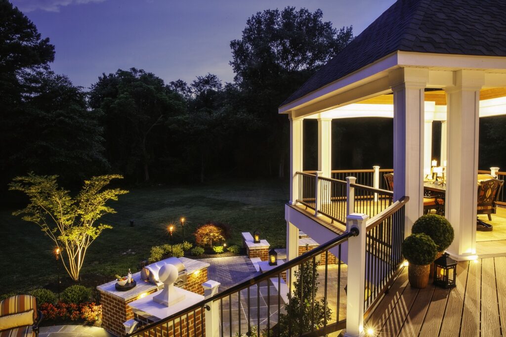 deck with flagstone patio and BBQ below
