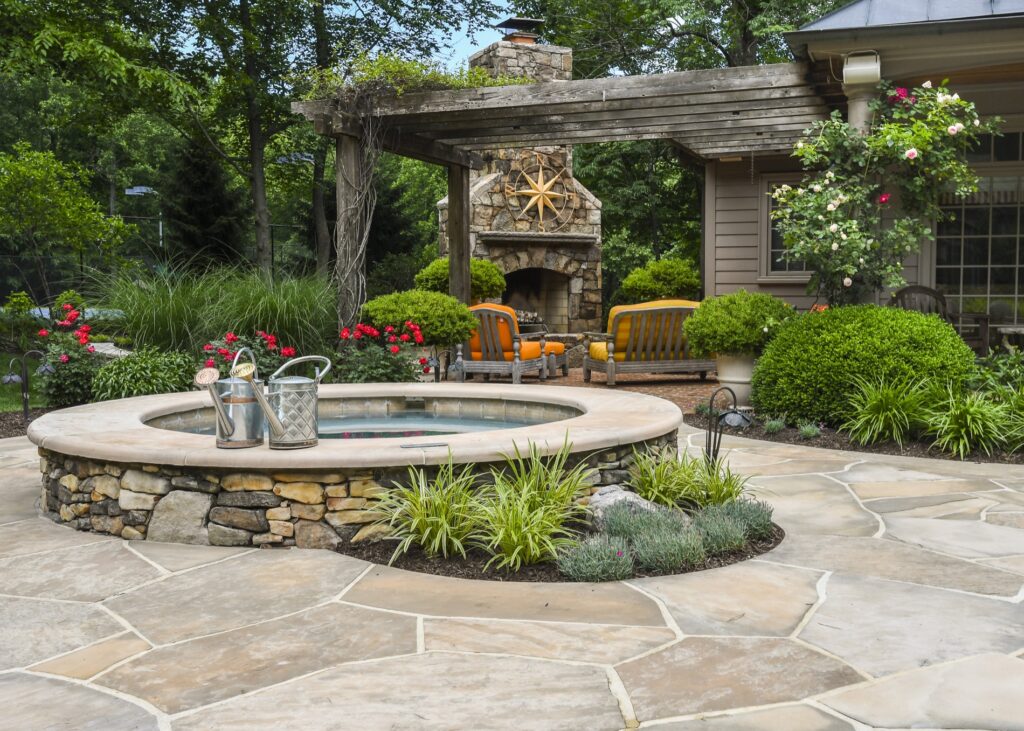 elevated spa and outdoor stone fireplace
